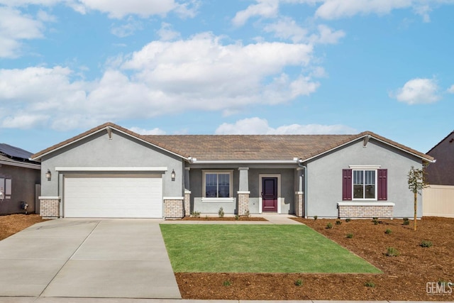 view of front of property featuring brick siding, stucco siding, a front yard, a garage, and driveway