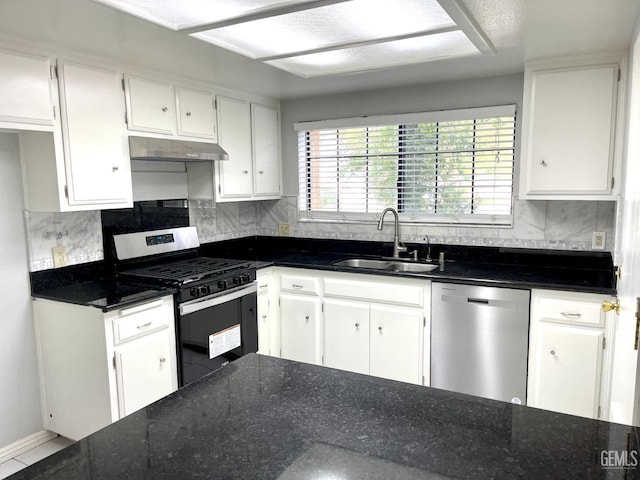 kitchen with dishwasher, under cabinet range hood, white cabinetry, a sink, and gas range
