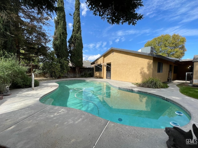 view of swimming pool with a fenced backyard, central air condition unit, a patio area, and a fenced in pool