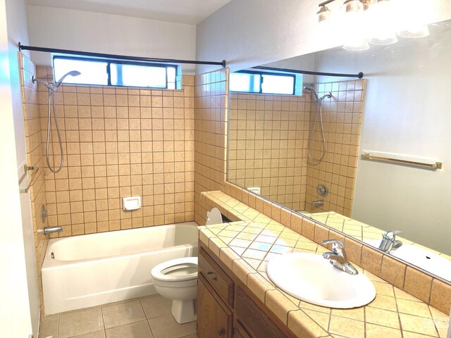 bathroom with toilet, vanity, shower / bathtub combination, and tile patterned flooring