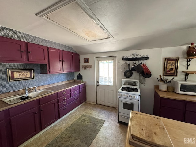 1 Jasper Ave, Rosamond, CA 93561 - kitchen with white appliances, lofted ceiling, and dark brown cabinets