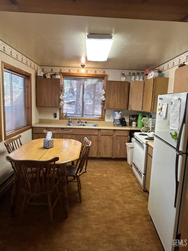 48718 Sugarpine Trl, Posey, CA 93260 - kitchen with white appliances, a sink, brown cabinetry, light countertops, and wallpapered walls