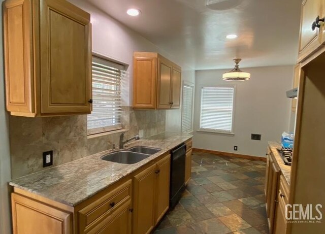 706 A St, Bakersfield, CA 93304 - kitchen featuring a sink, dishwasher, baseboards, backsplash, and plenty of natural light
