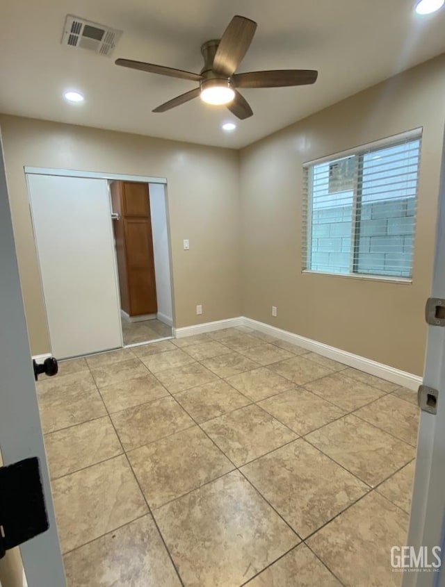 706 A St, Bakersfield, CA 93304 - unfurnished bedroom with recessed lighting, light tile patterned flooring, a closet, a ceiling fan, and baseboards