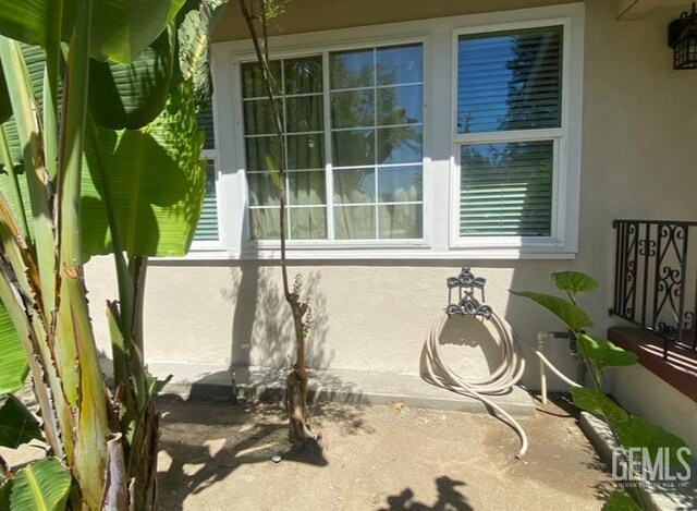 706 A St, Bakersfield, CA 93304 - view of side of home featuring stucco siding