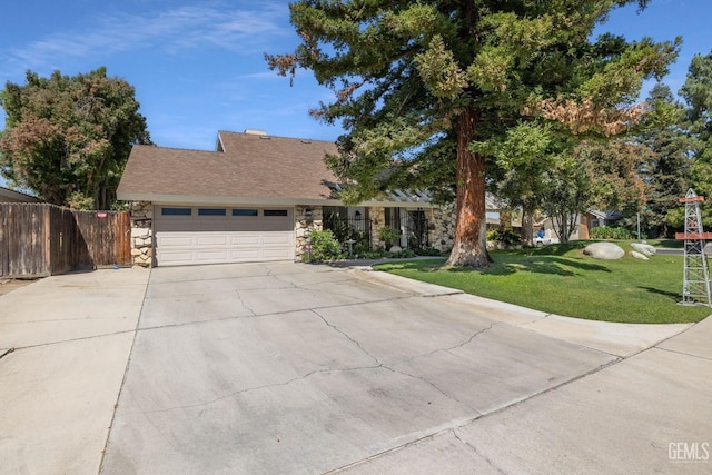 view of front of house with a garage and a front yard