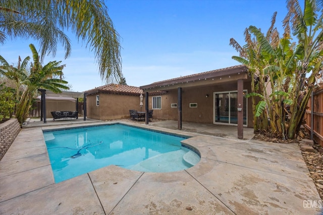 view of swimming pool with a patio area, a fenced backyard, and a fenced in pool