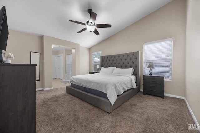 bedroom featuring vaulted ceiling, ceiling fan, carpet, and baseboards