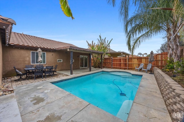 view of pool with a fenced in pool, a patio area, and fence