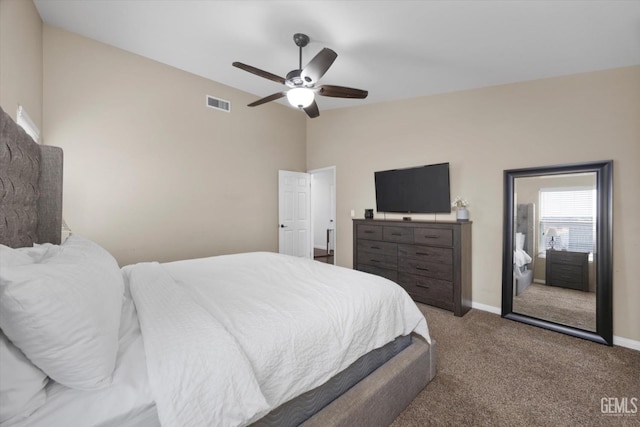 carpeted bedroom with vaulted ceiling, ceiling fan, visible vents, and baseboards