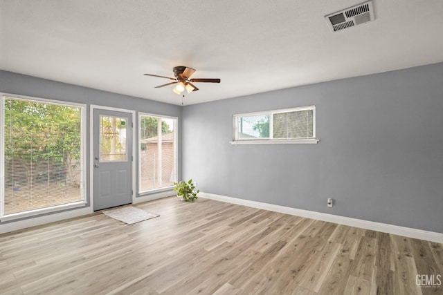 925 Yale Ave, Bakersfield, CA 93305 - unfurnished room featuring baseboards, wood finished floors, and ceiling fan