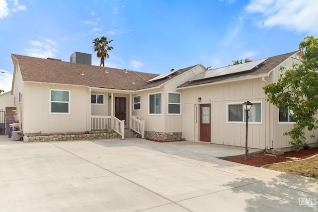 925 Yale Ave, Bakersfield, CA 93305 - view of front of property with solar panels, a chimney, and a shingled roof
