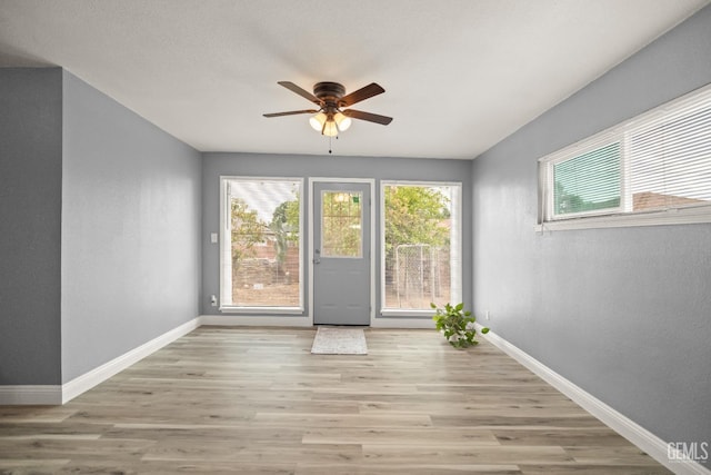 925 Yale Ave, Bakersfield, CA 93305 - unfurnished room with ceiling fan, plenty of natural light, baseboards, and wood finished floors