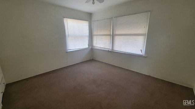 unfurnished room with a healthy amount of sunlight, carpet floors, and ceiling fan