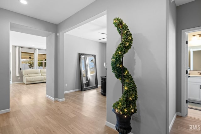 entrance foyer with light wood-type flooring, ceiling fan, baseboards, and recessed lighting