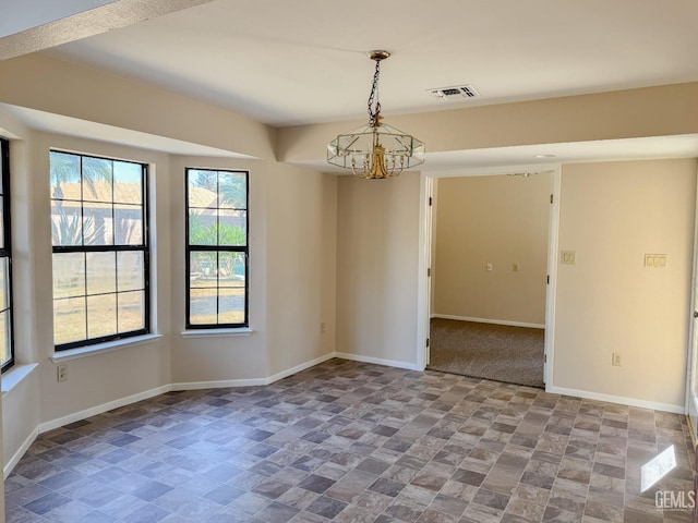 9004 Cresson Ct, Bakersfield, CA 93307 - spare room with stone finish floors, baseboards, and a chandelier