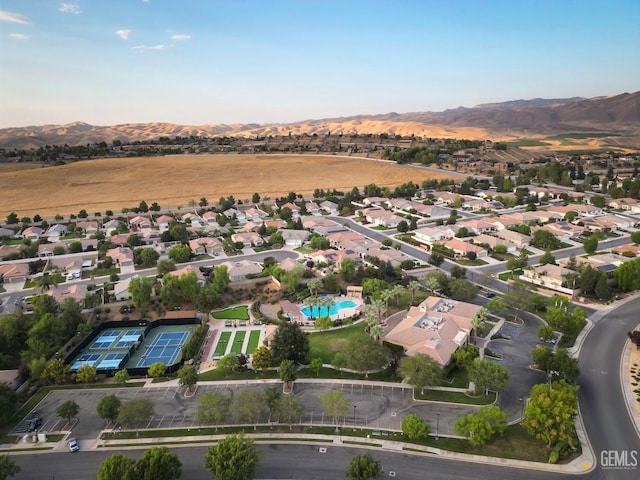 14010 Park Palisades Dr, Bakersfield, CA 93306 - view of property location with a mountainous background, nearby suburban area, and a pool
