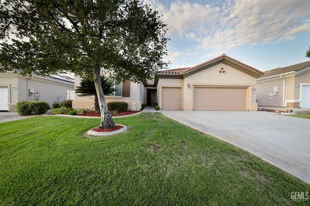 14010 Park Palisades Dr, Bakersfield, CA 93306 - mediterranean / spanish-style house featuring driveway, an attached garage, stucco siding, a front lawn, and a tile roof