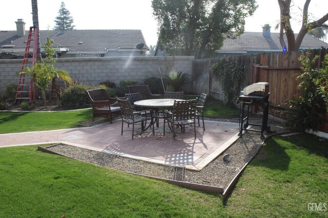 view of patio featuring a grill