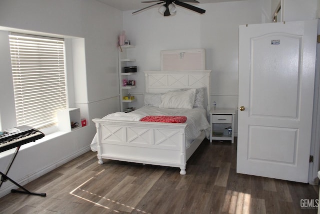 bedroom with ceiling fan and dark wood-type flooring