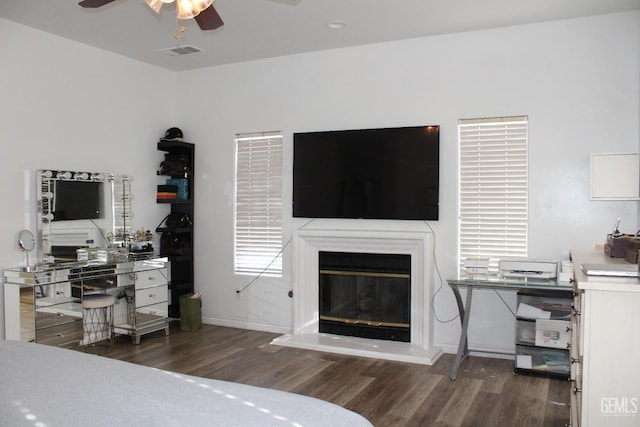 bedroom featuring dark hardwood / wood-style flooring and ceiling fan