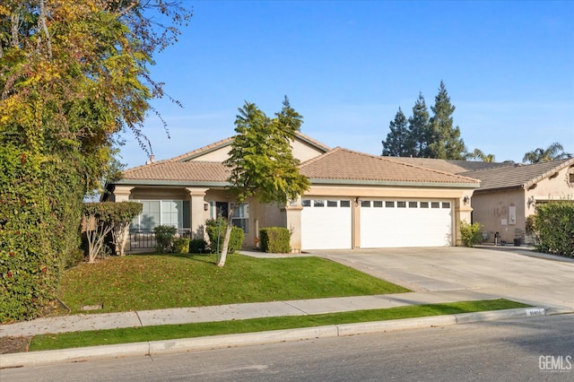 view of front facade with a garage and a front lawn