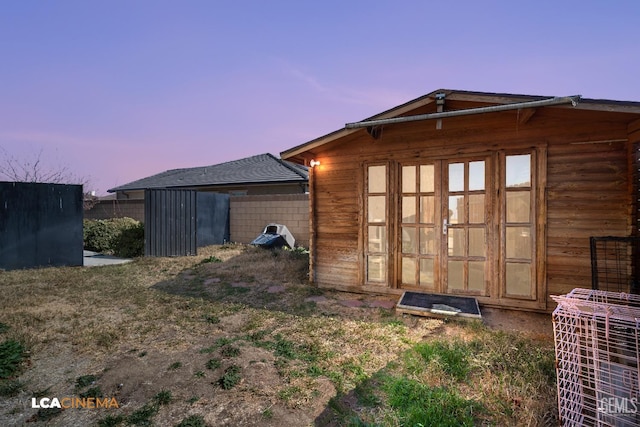 view of outdoor structure at dusk