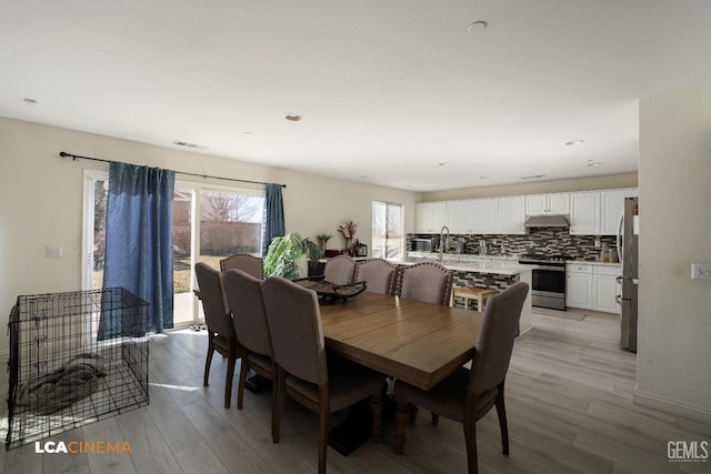 dining area featuring light hardwood / wood-style floors