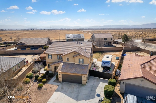 birds eye view of property with a mountain view