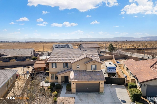 drone / aerial view featuring a mountain view