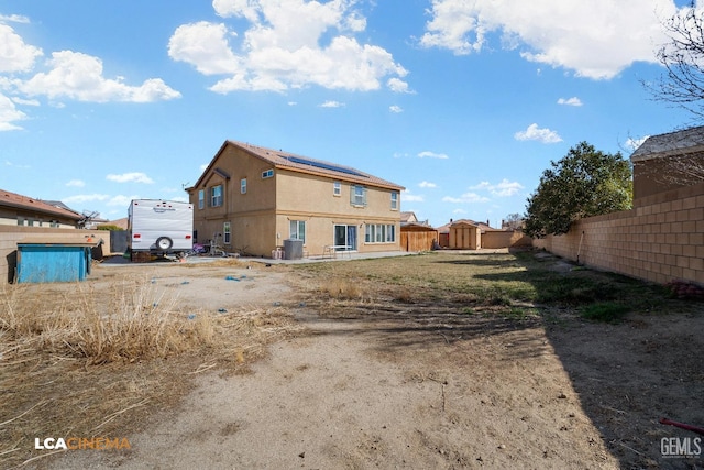 rear view of property featuring central air condition unit