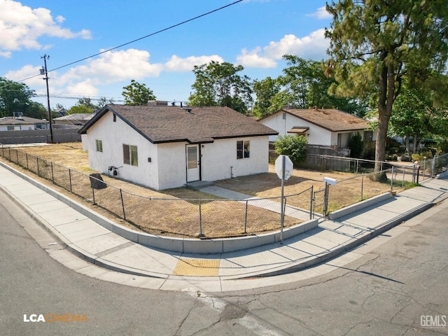 145 Kincaid St, Bakersfield, CA 93307 - single story home featuring stucco siding, a fenced backyard, and roof with shingles
