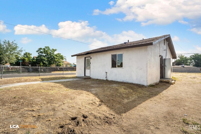 145 Kincaid St, Bakersfield, CA 93307 - rear view of property featuring stucco siding