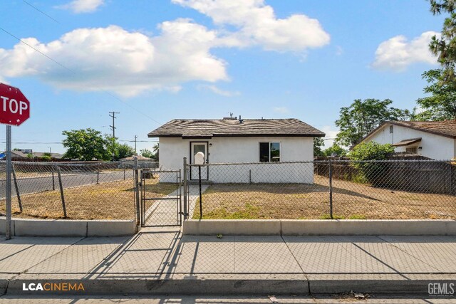 145 Kincaid St, Bakersfield, CA 93307 - view of front of house with a gate and stucco siding