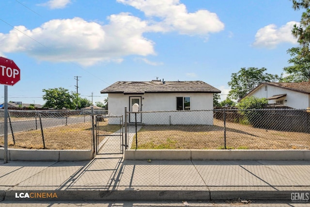 145 Kincaid St, Bakersfield, CA 93307 - view of front of property featuring a gate and stucco siding