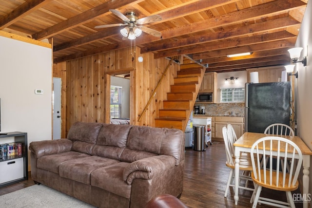 45985 Ridge Rd, Posey, CA 93260 - living room with beam ceiling, stairway, a wealth of natural light, and dark wood-style flooring