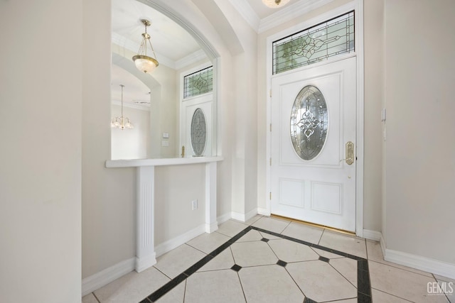 1904 Wedgemont Pl, Bakersfield, CA 93311 - entryway with ornamental molding, arched walkways, baseboards, and a chandelier