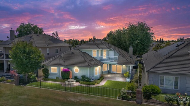 1904 Wedgemont Pl, Bakersfield, CA 93311 - view of front facade with a chimney, a balcony, and a tiled roof