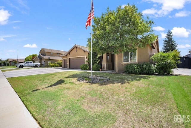 view of front of house with a front lawn and a garage