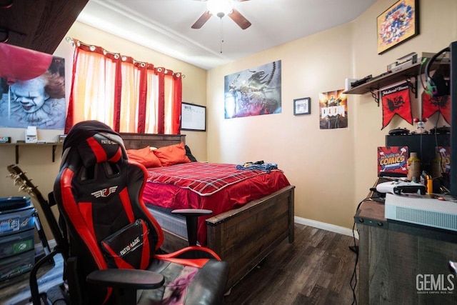 bedroom with ceiling fan and dark hardwood / wood-style flooring