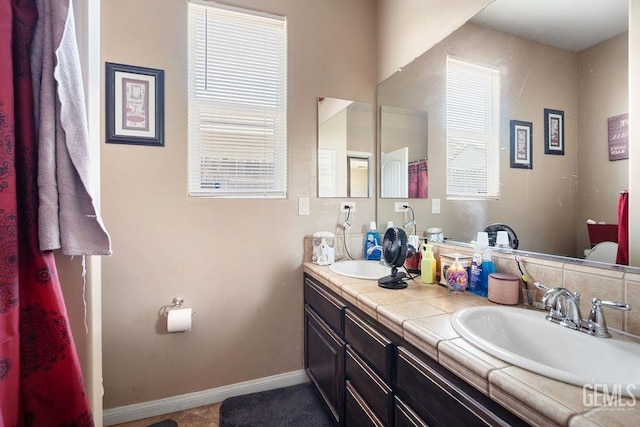 bathroom with vanity and tile patterned flooring