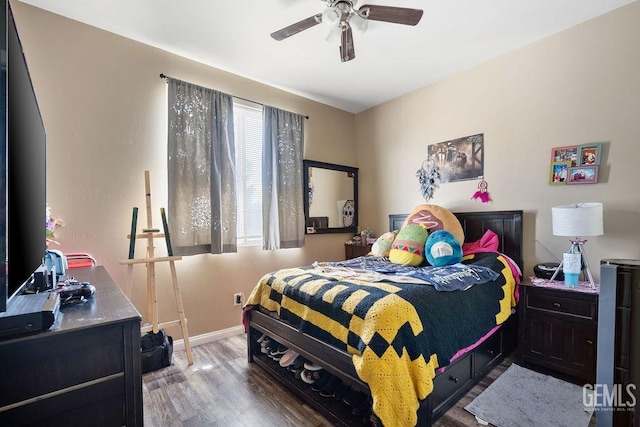 bedroom featuring ceiling fan and hardwood / wood-style flooring