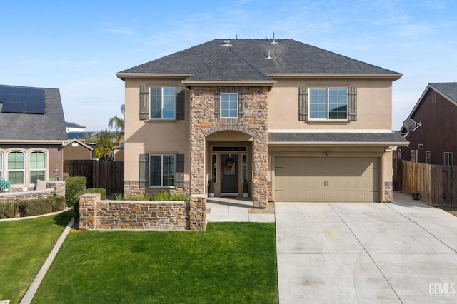 view of front of home with a garage and a front lawn