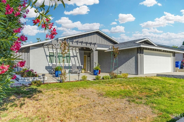 404 Mckinley St, Taft, CA 93268 - view of front facade with a garage, a front yard, and stucco siding