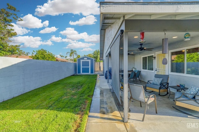 404 Mckinley St, Taft, CA 93268 - fenced backyard with a storage unit, a patio area, and ceiling fan