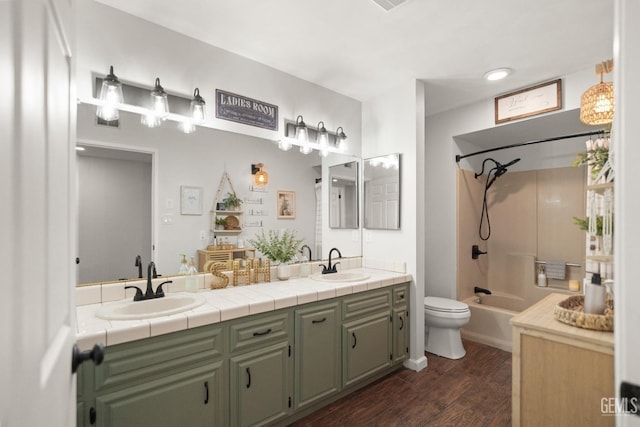404 Mckinley St, Taft, CA 93268 - full bathroom with double vanity, wood finished floors, and bathing tub / shower combination