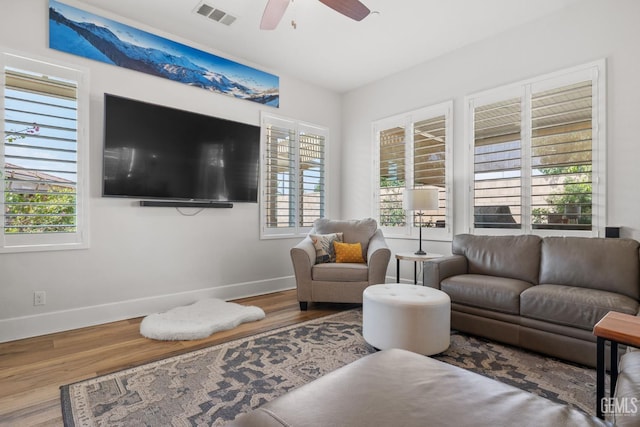9700 Kingsport Pl, Bakersfield, CA 93306 - living area with baseboards, wood finished floors, healthy amount of natural light, and a ceiling fan