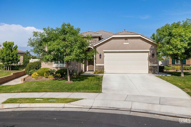9700 Kingsport Pl, Bakersfield, CA 93306 - view of front facade featuring stone siding, stucco siding, an attached garage, and driveway