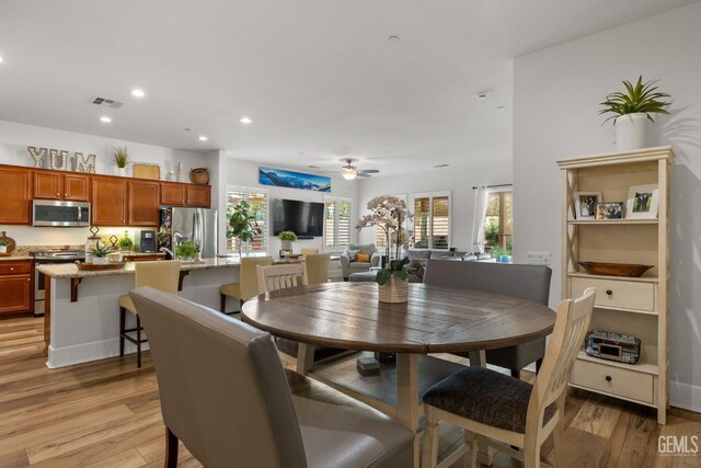 9700 Kingsport Pl, Bakersfield, CA 93306 - dining area featuring light wood finished floors, a ceiling fan, and recessed lighting