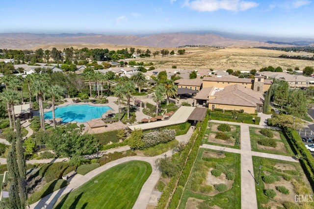 9700 Kingsport Pl, Bakersfield, CA 93306 - aerial perspective of suburban area with a pool and a mountainous background